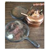 Cast iron skillets and copper tea pot