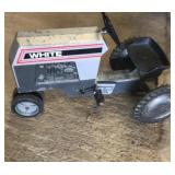 White toy peddle tractor White toy peddle tractor
