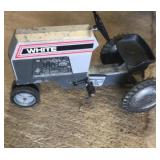 White toy peddle tractor