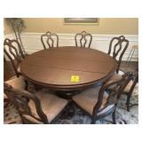 Nice 6 foot dining room table with eight chairs