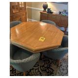 Table and four chairs chairs are on rollers 54' x