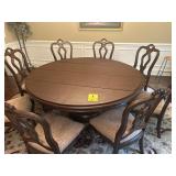 Nice 6 foot dining room table with eight chairs