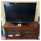 Samsung TV, TV cabinet and 2 DVD players. TV