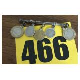 Foreign coins on bracket