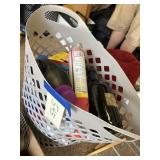 Laundry basket, full of cleaning supplies and