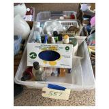 Two clear totes of lotions and bathroom supplies