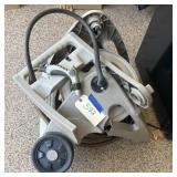 Broken hose reel, but has a good hose