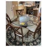 54 inches across and 29 inches tall glass top