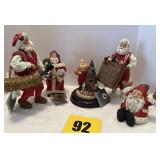 Five Santa Claus, including golfer, Santa Claus