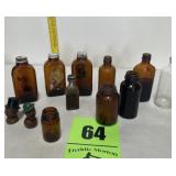 Brown bottles two liquor stoppers
