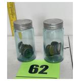 (2) small jars with bottle caps inside