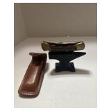 Buck knife with leather case anvil is for display