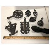 IRON TRIVETS LOT