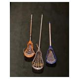 3 lacrosse sticks