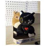 Squishmallow and plush cat