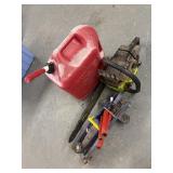 Gas can , chain saw and jack