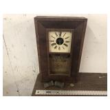 CLOCK WITH WEIGHTS AND PENDULUM