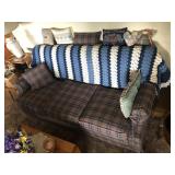 SOFA WITH PILLOWS AND BLANKETS
