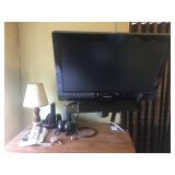 TV, STAND AND CONTENTS ON DRESSER