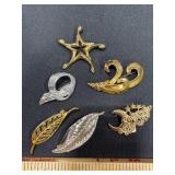 Six Metal Brooches