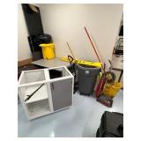 Table, Vacuums, Trash Can and Counter