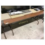 Folding table w/ wood grain laminate surface