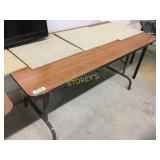 Folding table w/ wood grain laminate surface