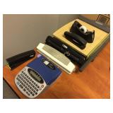 Office supplies including label maker, paper cutte
