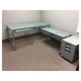 L-shaped glass top desk on metal base, including