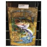 "A fisherman lives here" sign