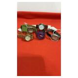 5 Wrist Watches, needs Batteries, one has green