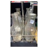 Vintage milk carrier with glass bottles