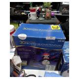 Frosted skating penguin- lighted yard sculpture