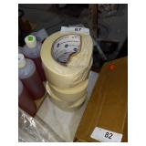 Partial rolls of masking tape.