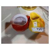 1. 2 creamer dishes one orange and one yellow