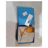 28. Gold colored cross and dog tag with our