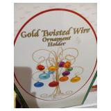 Gold Twisted wire ornament holder.  high bidder