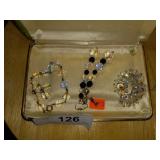 Glass bracelet and assorted earrings