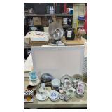 Assorted tea cups , saucers and decor