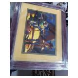 Framed, matted buzz and woody,
