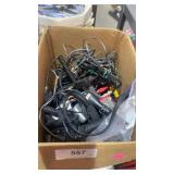 Box of misc phone cables and chargers