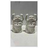 2 white glass Buddhas