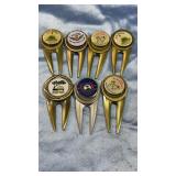 7 Collectable Metal Golf Tee Markers from Various 7 Collectable Metal Golf Tee Markers from Various