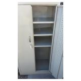 Metal storage cabinet with shelves