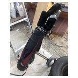 golf caddy and clubs