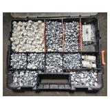 CONTAINER OF WHITE COLORED SCREWS