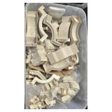 large tub of plastic trim pieces for metal awnings