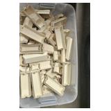 large tub of plastic trim pieces for metal awnings