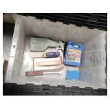 tub with miscellaneous tile tools and grout sealer