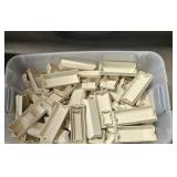 large tub of plastic trim pieces for metal awnings
